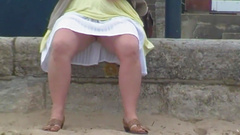 Wife showing red crotchless panties on the pier at Swanage.